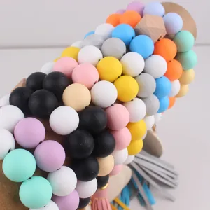 Detailed view of colorful silicone keychain featuring round beads and stylish tassel design.