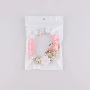 Silicone beaded keychain bracelet with daisy flower charm and leopard print beads for women.