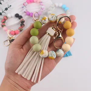Llavero de pulsera con cuentas de silicona y borla lindo anillo para mujeres niñas