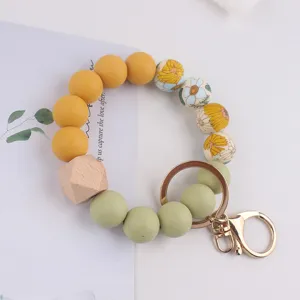 Silicone bead wristlet keychain with floral and wooden charm for women fashion daily use