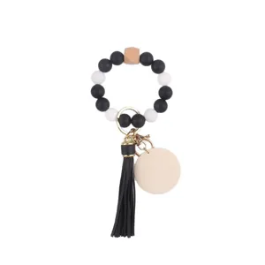 Silicone beaded keychain with leather tassel and wooden charm for women fashion daily use