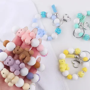 Colorful silicone 3D bear beaded wristlet keychain with cute cartoon bear pendants.