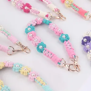 Handmade braided daisy pearl cup strap for tumbler accessory, colorful woven floral handle.