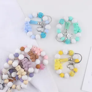 Silicone bear beaded keychain bracelet with cute charm, stylish wristlet key ring accessories.