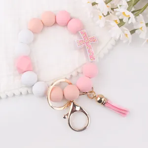 Silicone bead keychain bracelet with pink daisy cross pendant and cute tassel for women stylish
