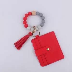 Pulsera llavero de cuentas de silicona con tarjetero de cuero PU monedero y borla para mujeres