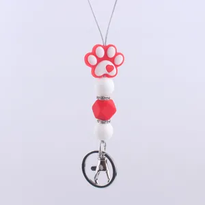 Cute silicone paw print keychain charm bead lanyard accessory for keys and bags decor.