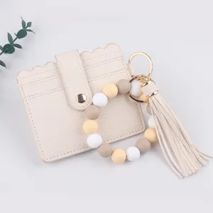 Porte-cartes en cuir PU avec bracelet perles silicone et porte-clés gland, portefeuille élégant.