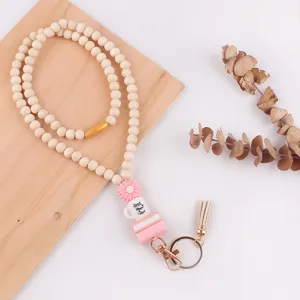 Houten kralen lanyard sleutelhanger met siliconen madeliefje boeken kwast en metalen haak.