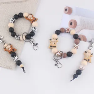 Silikon Perlen Armband Schlüsselanhänger Set mit niedlichen Hochlandrind Anhängern und Metallclips.