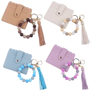 Porte-carte en cuir PU avec porte-clés bracelet en perles de silicone et gland pour femmes.