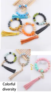 Silicone beaded bracelet keychain with PU leather tassel, colorful DIY key ring accessories.