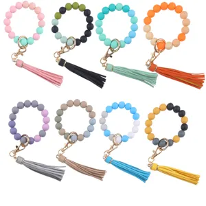 Colorful silicone bead keychain bracelet with PU leather tassel, stylish bangle key ring.