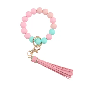 Silicone beaded wristlet keychain with PU leather tassel, cute key ring accessory for women.