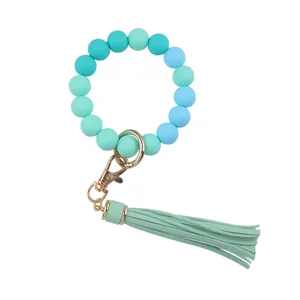 Silicone beaded bracelet keychain with PU leather tassel, trendy gradient blue design.