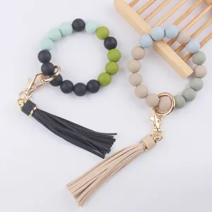 Silicone beaded keychain with PU leather tassel, stylish wristlet bracelet keyring for women.