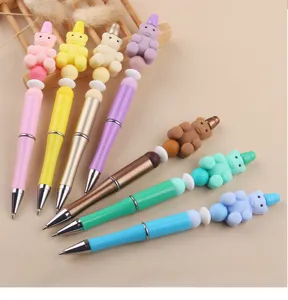 Colorful DIY beadable ballpoint pens with cute silicone bear toppers for creative stationery use.