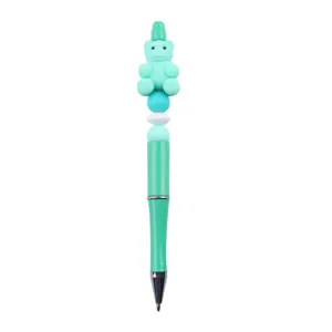 Silicone bear beaded pen detail shot, cute DIY green ballpoint pen close up view, craft stationery