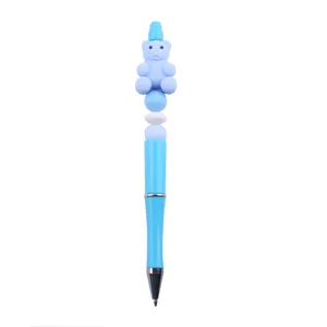 Blue silicone bear bead pen detail showcasing cute design, plastic barrel and smooth tip.