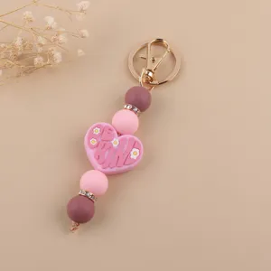 Portachiavi in perline di silicone fatto a mano con ciondolo a cuore per borse.