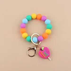 Llavero de pulsera de cuentas de silicona coloridas con bonito colgante de manzana para diario.