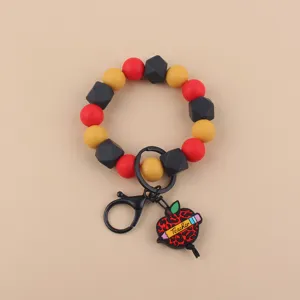 Llavero de cuentas de silicona con pulsera con colgante de manzana de profesor.