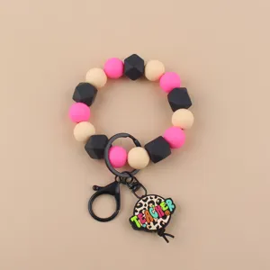 Detalle pulsera llavero cuentas silicona, colgante leopardo profesor, accesorio