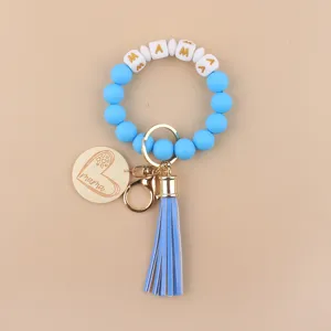 Blauer Silikonperlen Armband Schlüsselanhänger mit Holz Mama Anhänger und Buchstaben Perlen.