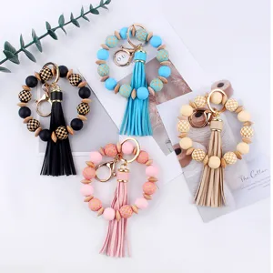 Pulsera llavero colorida de cuentas de silicona y madera con borla de cuero PU accesorio elegante