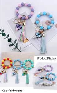 Silicone beaded wristlet keychain featuring cute cartoon butterfly charm and leather tassel.