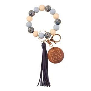 Silicone bead wristlet keychain with wooden MAMA charm and tassel for women daily use.
