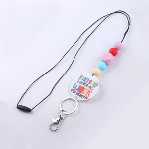 Cordón de cuentas de silicona de colores con colgante temático de profesor y llavero de metal.