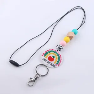 Cordón llavero para profesores con cuentas de silicona coloridas y colgante acrílico.