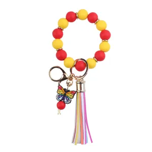 Colorful silicone beaded wristlet keychain with butterfly pendant and PU leather tassel accessory.