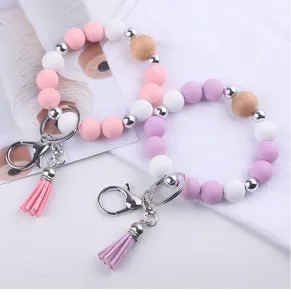 Silicone beaded wristlet keychain detail showing colorful round beads and cute leather tassel.