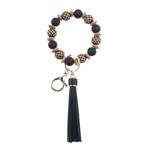 Llavero de pulsera de cuentas de madera de silicona con borla de cuero PU negro, elegante.