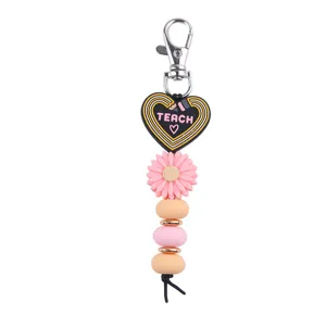 Porte-clés pendentif marguerite en perles DIY créatif, charmant accessoire de sac élégant.
