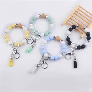 Silicone bead keychain bracelet set with natural wood beads and tassel detail view