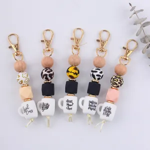 Modischer Silikon Perlen Schlüsselanhänger mit Kaffeetasse Anhänger Taschenschmuck.