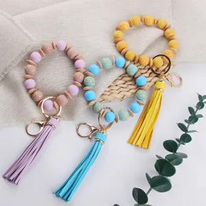 Llavero de pulsera de cuentas de silicona con borla de cuero PU lindo conjunto