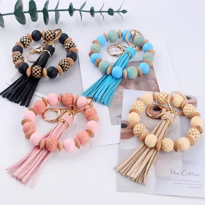 Llavero de pulsera con cuentas de silicona y madera y borla de cuero accesorios elegantes