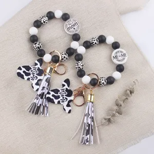 Silicone bead keychain with cow print tassel and mama charm, stylish wristlet key ring for women.