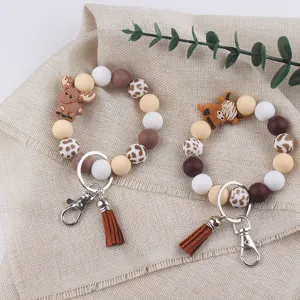 Llavero de cuentas de silicona con borla de cuero y colgante de animales para bolsos.