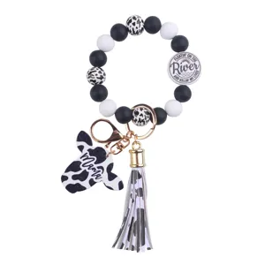 Cow print silicone bead wristlet keychain with tassel and cute Mama cow head pendant.