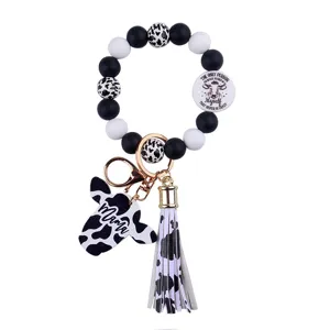 Silicone beaded cow print keychain with tassel, cute western animal ring wristlet for women.