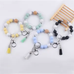 Colorful silicone beaded wristlet keychain with natural wooden beads and tassel charm