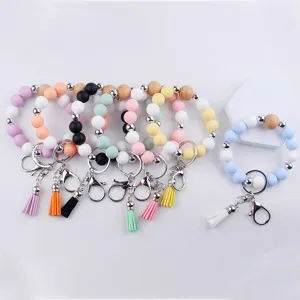 Silicone beaded keychain wristlet with colorful round beads, wooden beads, and cute tassel.