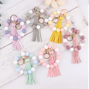 Silicone bead wristlet keychain with leather tassel, colorful handmade wrist strap detail.