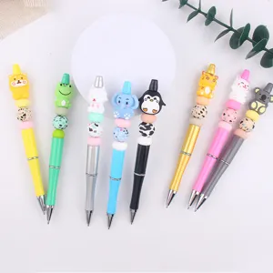 Detailed view of DIY cartoon 3D animal silicone beaded ballpoint pens with colorful plastic bodies.