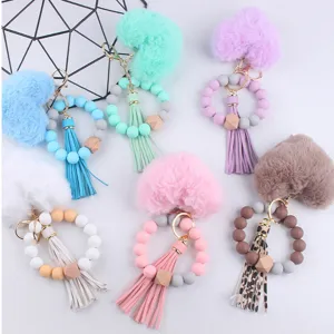 Flauschiges Herz Silikon Perlen Armband Schlüsselanhänger mit PU Leder Quasten.